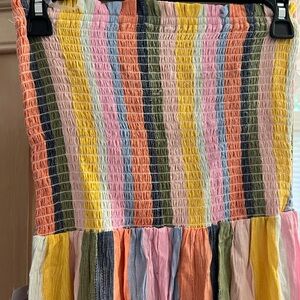 New with tags strapless boho jumpsuit with crotchet hem and open leg.